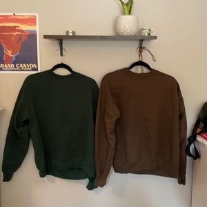 Green and brown crewnecks in a package.